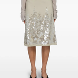 Tan skirts worn by a person, showing the skirts fit