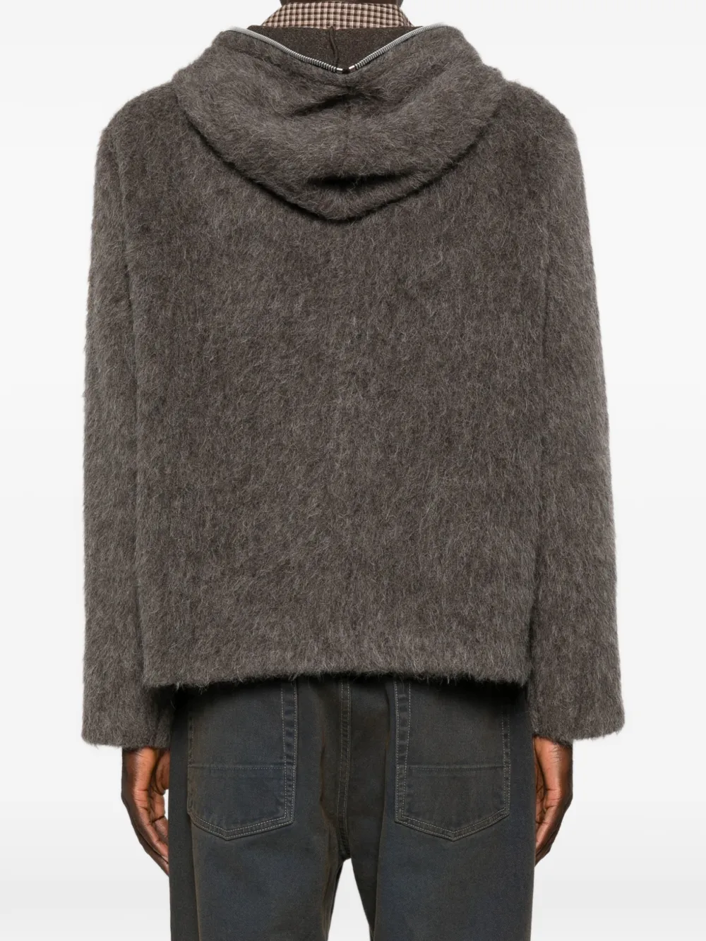 grey hoodie worn by a person, showing the hoodie fit