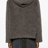 grey hoodie worn by a person, showing the hoodie fit