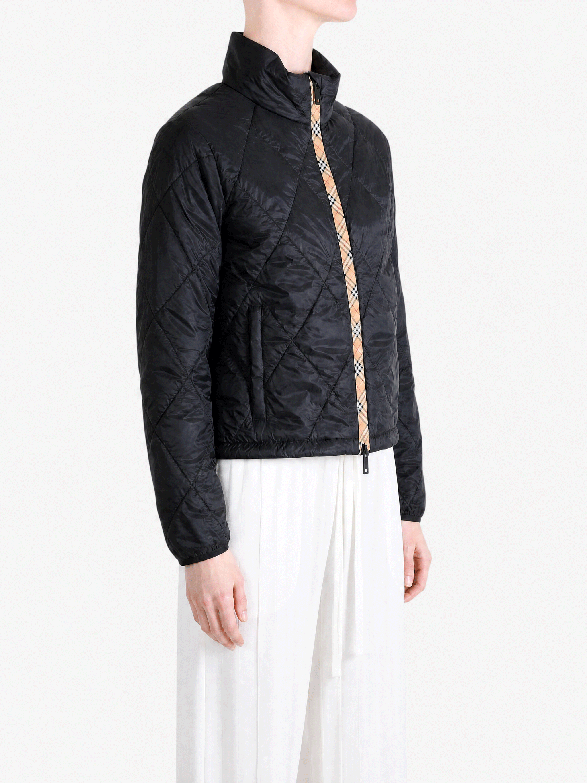 Black jacket worn by a person, showing the jacket fit