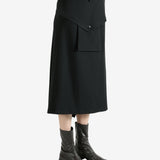 Black skirts worn by a person, showing the skirts fit