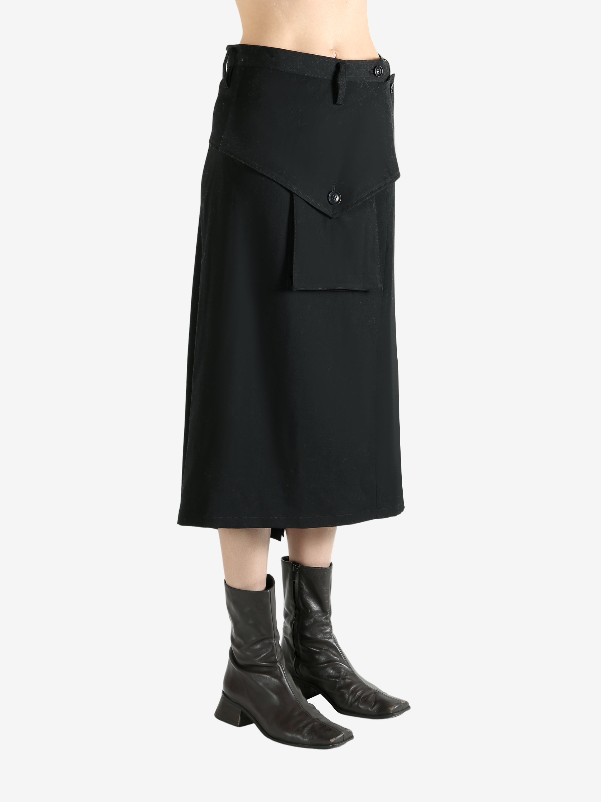 Black skirts worn by a person, showing the skirts fit