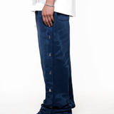 Black pants worn by a person, showing the pants fit