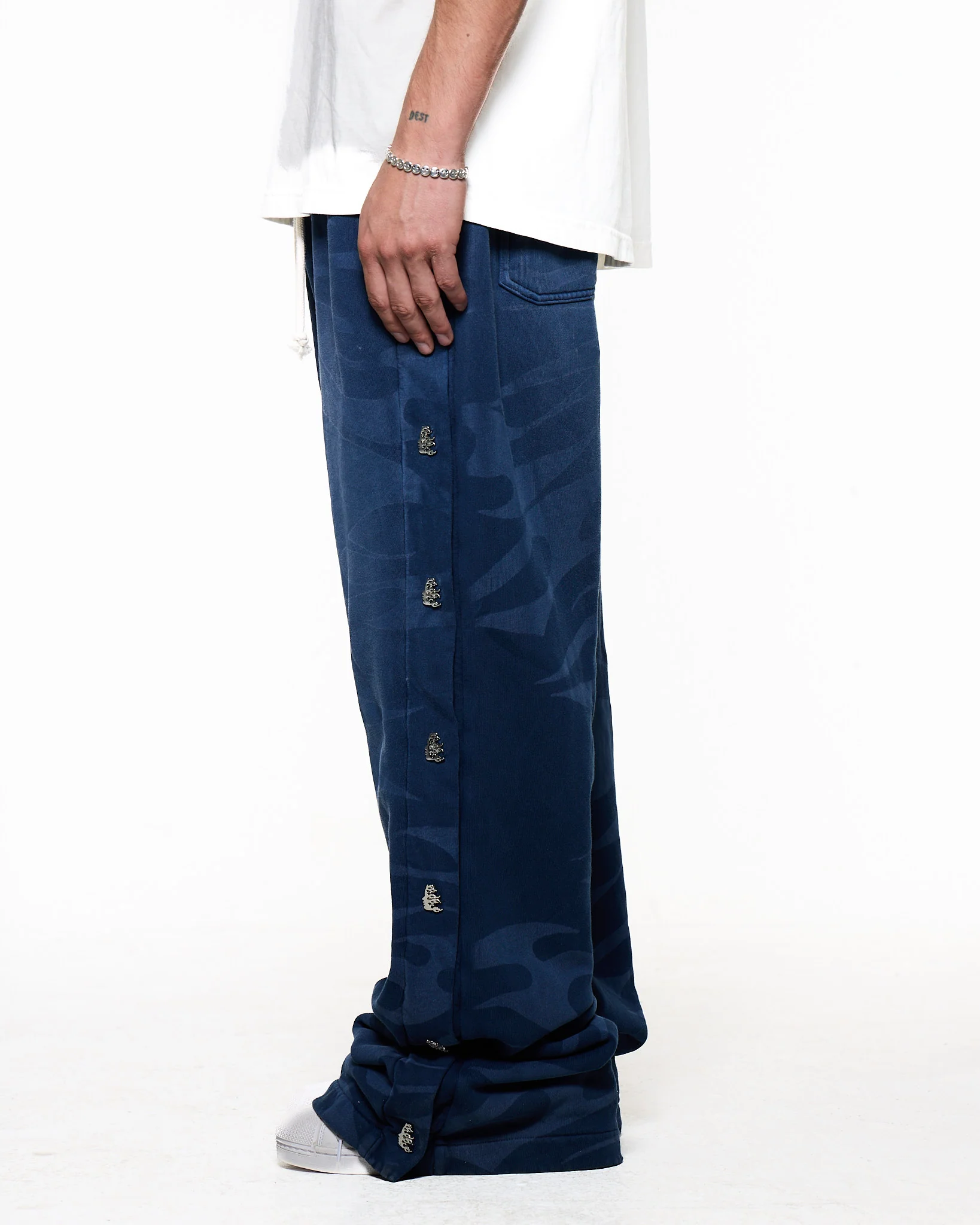 Black pants worn by a person, showing the pants fit