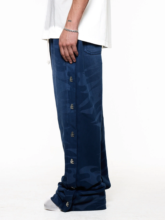 Black pants worn by a person, showing the pants fit