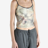 Grey top worn by a person, showing the fit