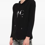 Black hoodie worn by a person, showing the hoodie fit