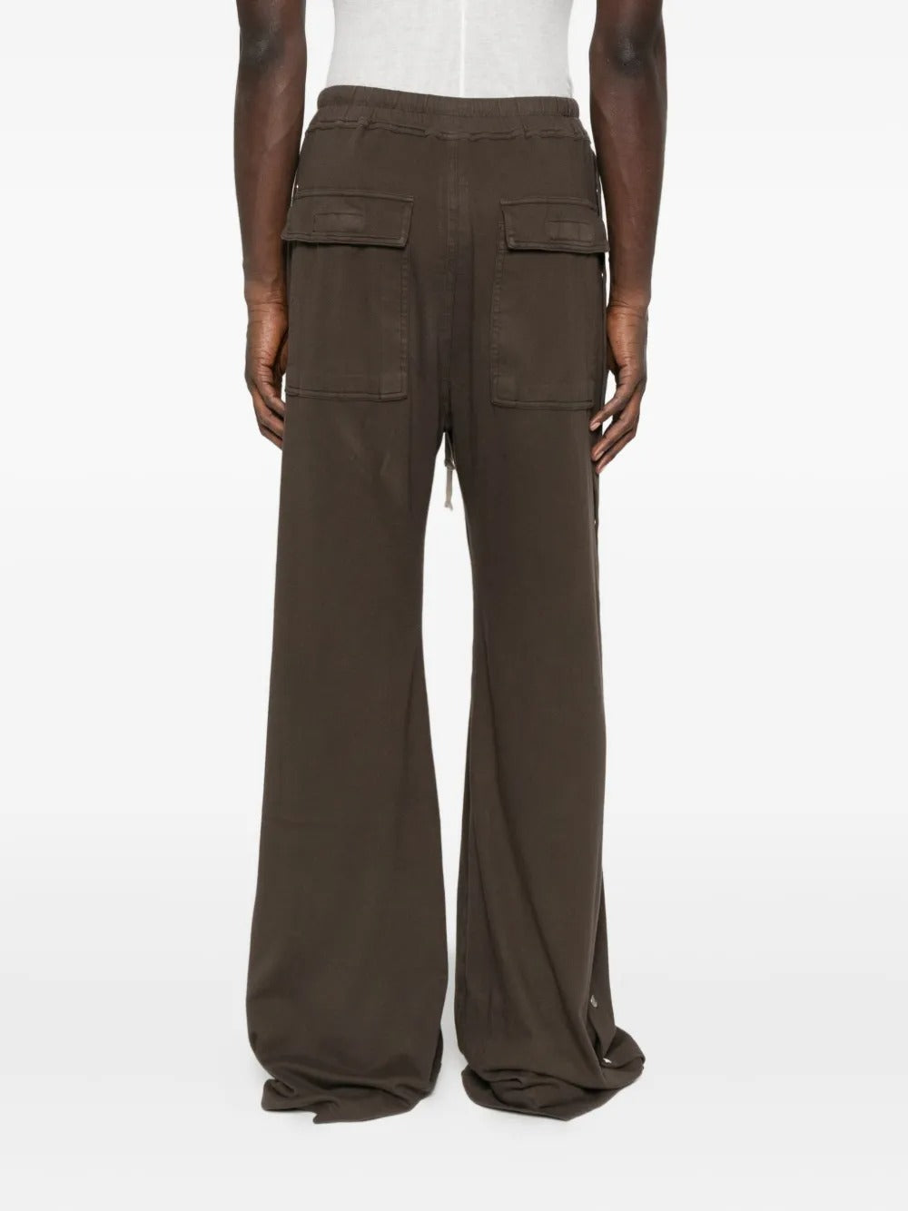 Brown pants worn by a person, showing the pants' fit