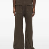 Brown pants worn by a person, showing the pants' fit