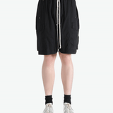 Black shorts worn by a person, showing the shorts fit