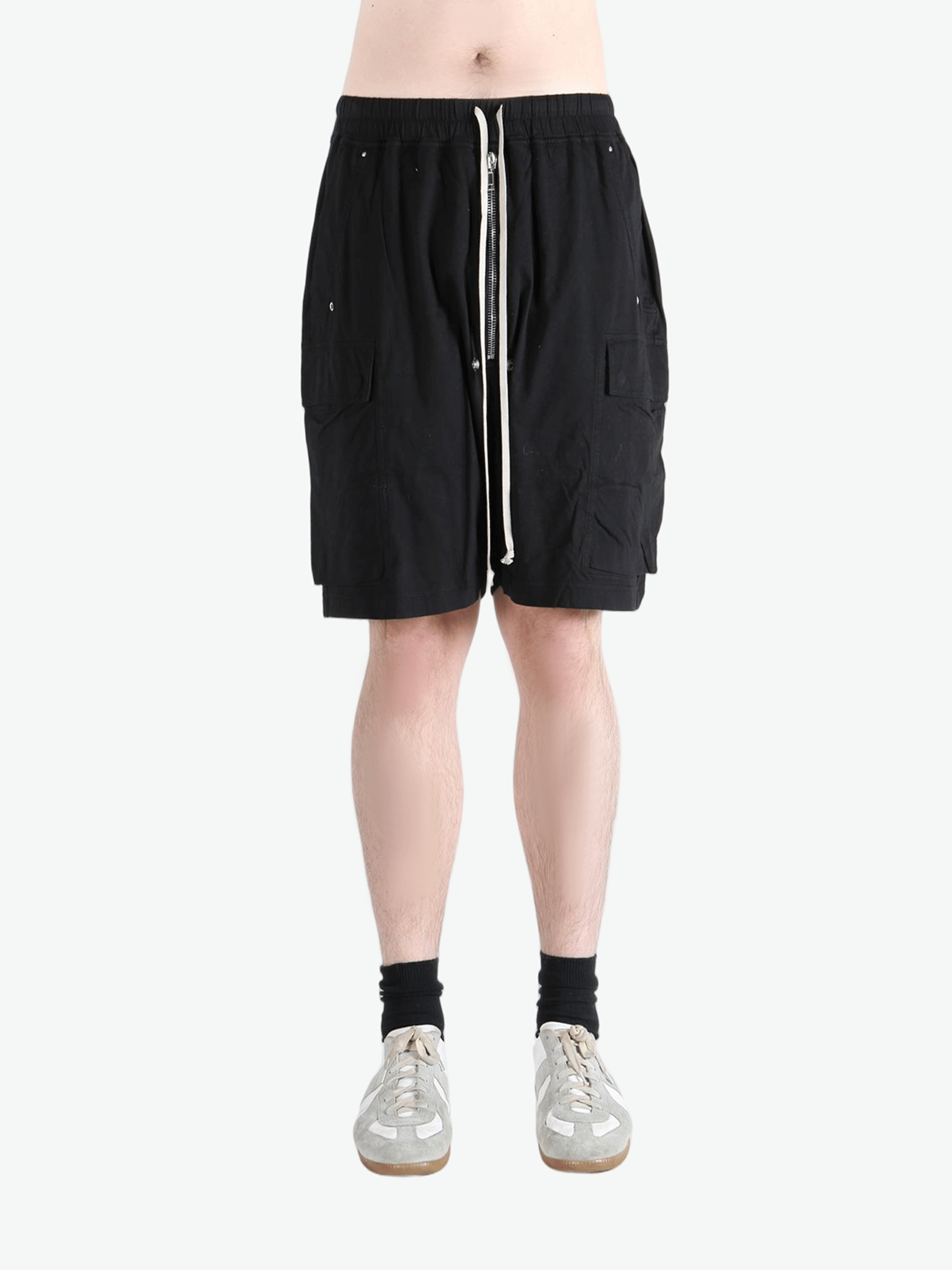 Black shorts worn by a person, showing the shorts fit