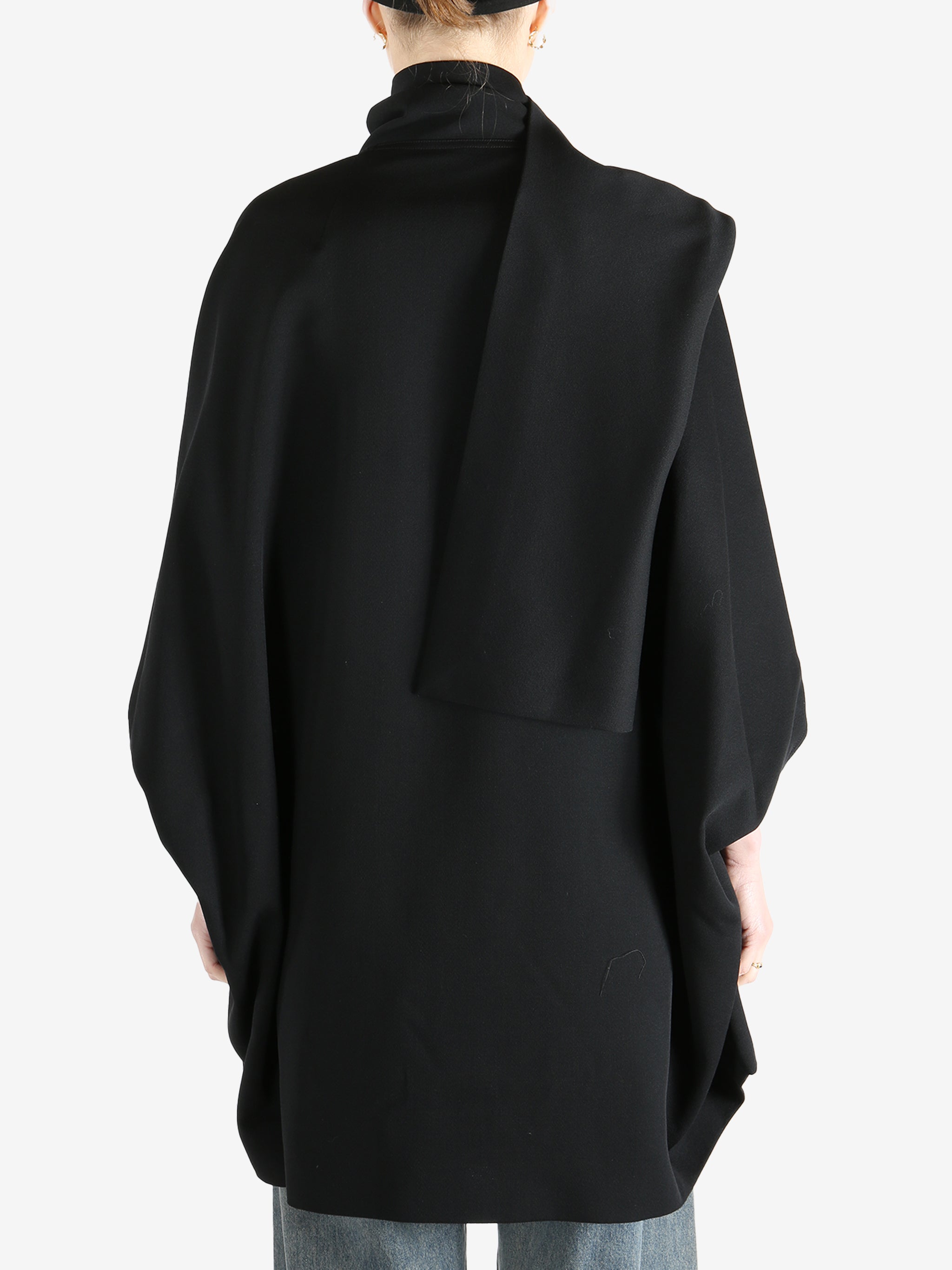 Black jackets worn by a person, showing the jackets fit