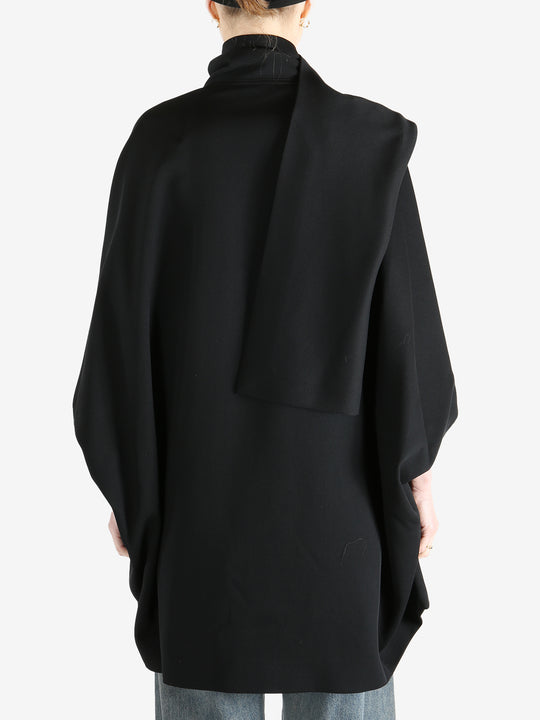 Black jackets worn by a person, showing the jackets fit