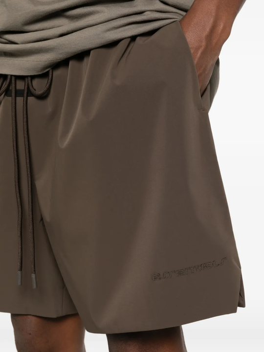 Close up of brown shorts, showing texture of the Polyester fabric