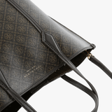 Close up of black bags, showing texture of the fabric