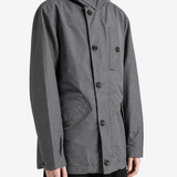 Grey jacket worn by a person, showing the jacket fit