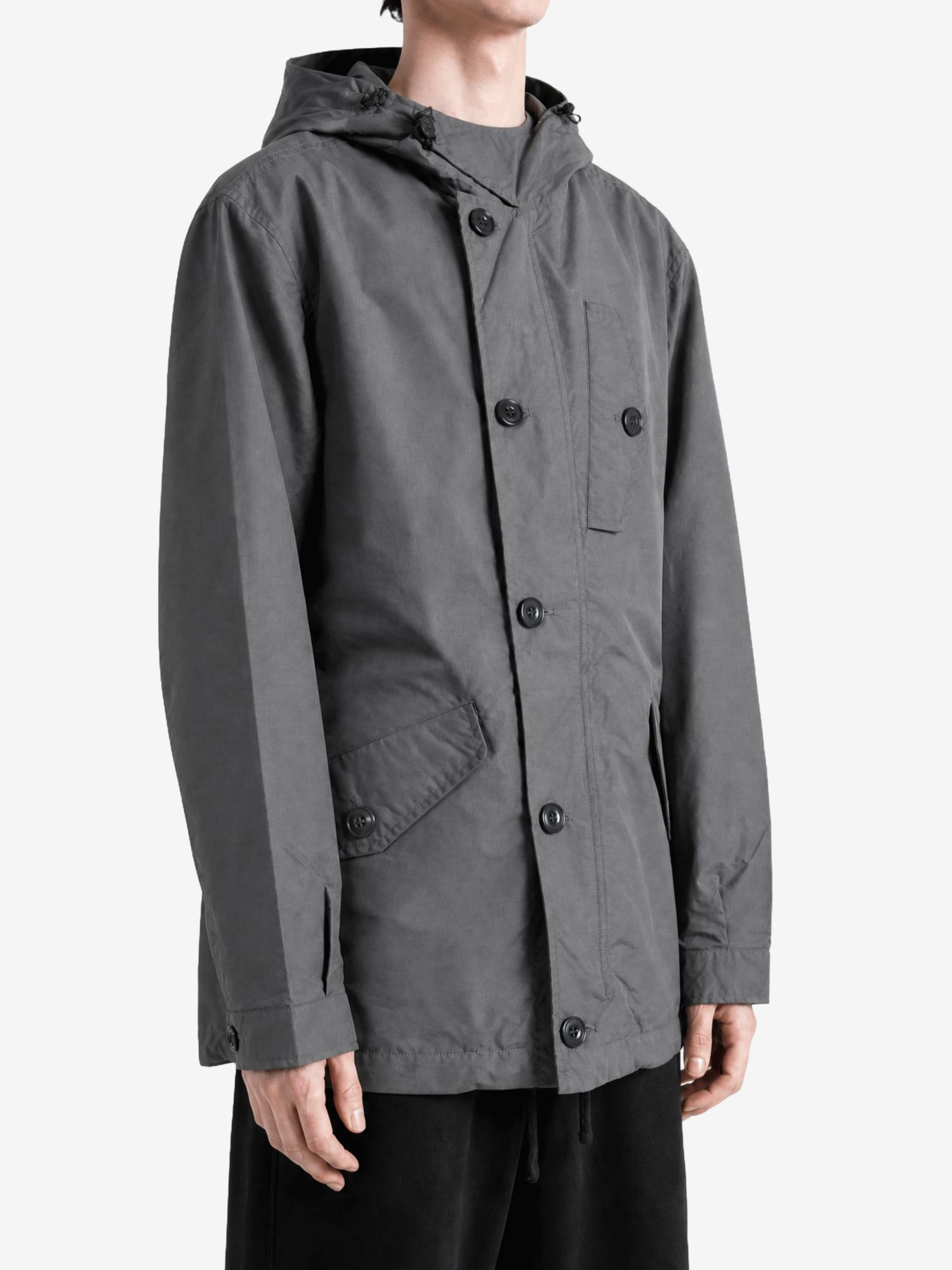 Grey jacket worn by a person, showing the jacket fit