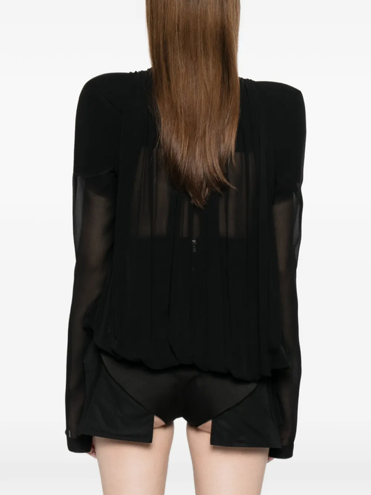 Black jacket worn by a person, showing the jacket fit