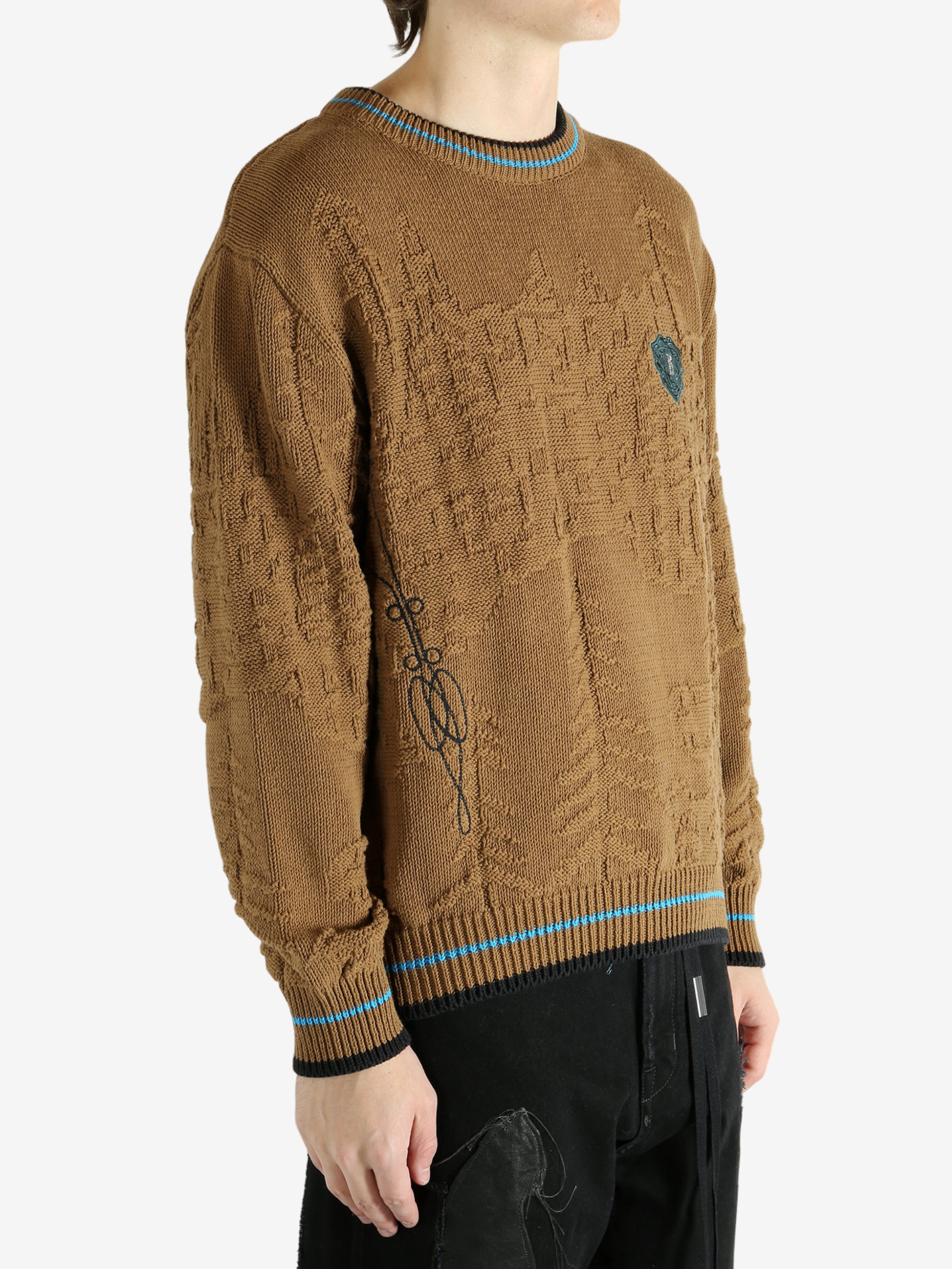 Brown jumper worn by a person, showing the jumper's fit