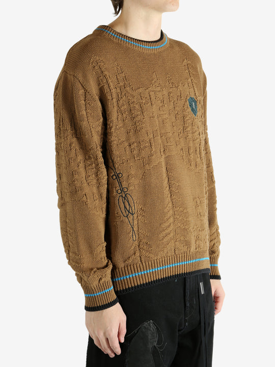 Brown jumper worn by a person, showing the jumper's fit