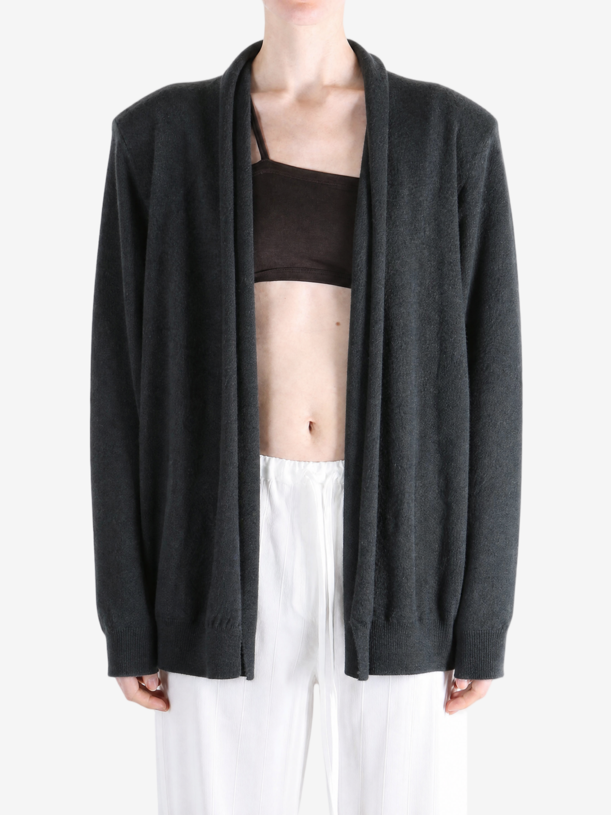 Grey knitwear worn by a person, showing the knitwear fit