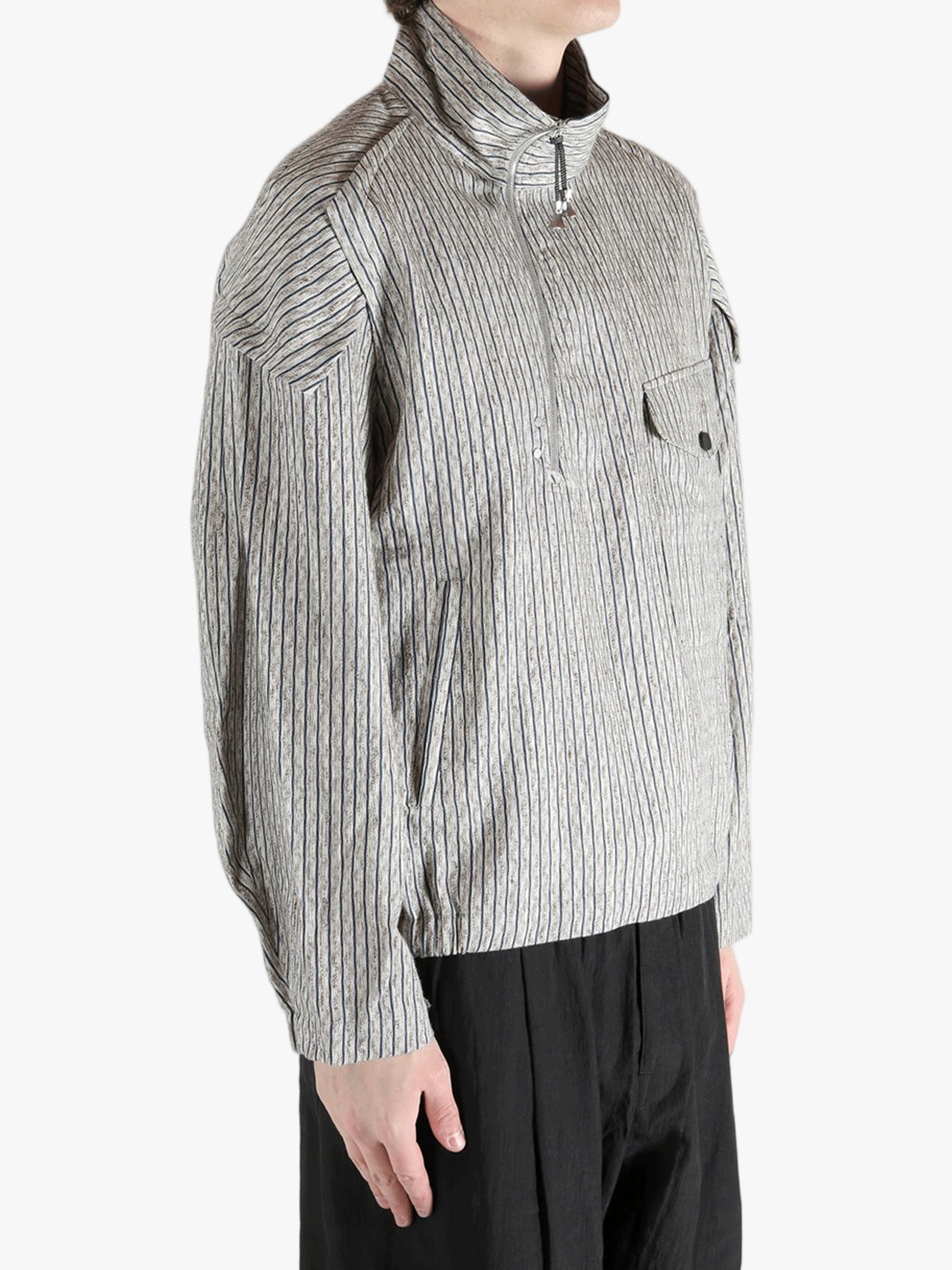 Grey jackets-coats worn by a person, showing the jackets-coats's fit