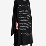 Black dress worn by a person, showing the dress fit