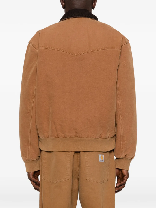 brown jackets-coats worn by a person, showing the jackets-coats fit