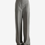 Grey pants worn by a person, showing the pants fit