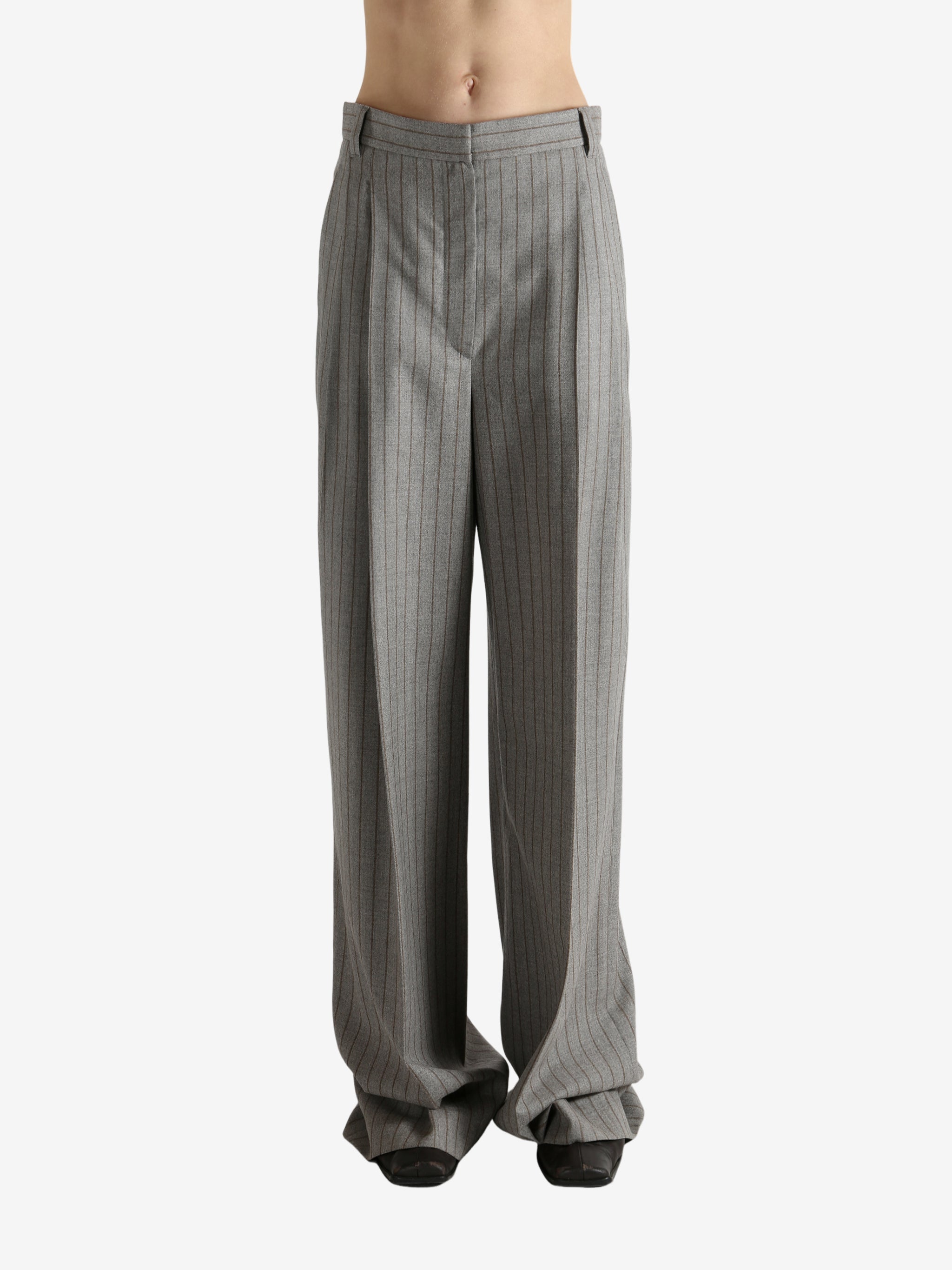 Grey pants worn by a person, showing the pants fit