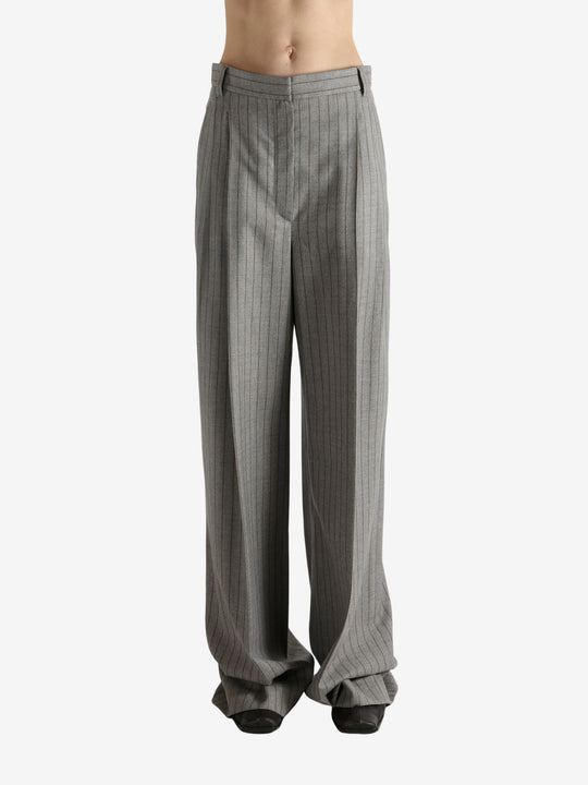 Grey pants worn by a person, showing the pants fit