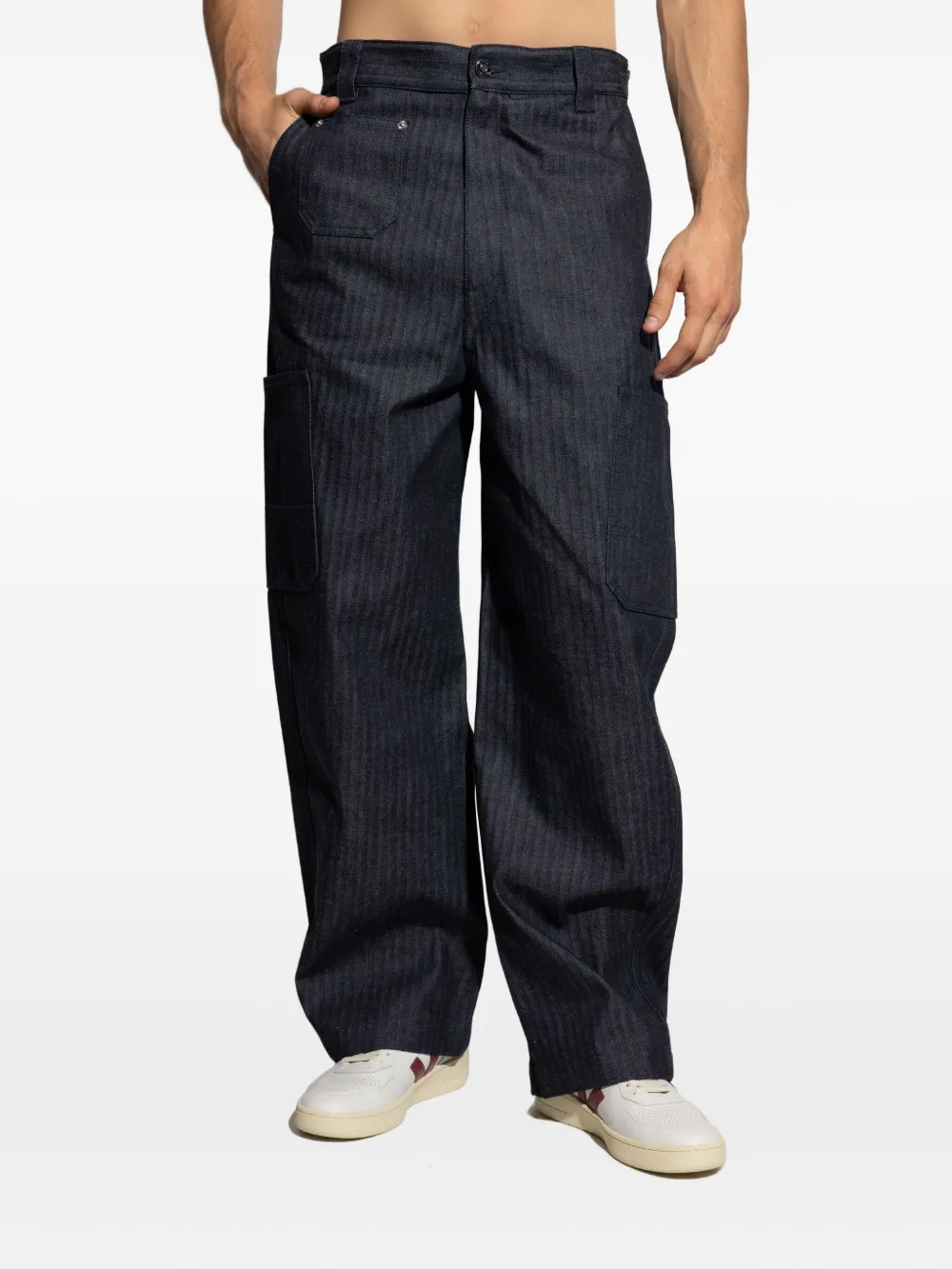 Blue pants worn by a person, showing the pants' fit