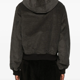 Brown jackets worn by a person, showing the jackets fit