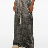 Grey pants worn by a person, showing the pants fit