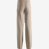 Beige pants worn by a person, showing the pants fit