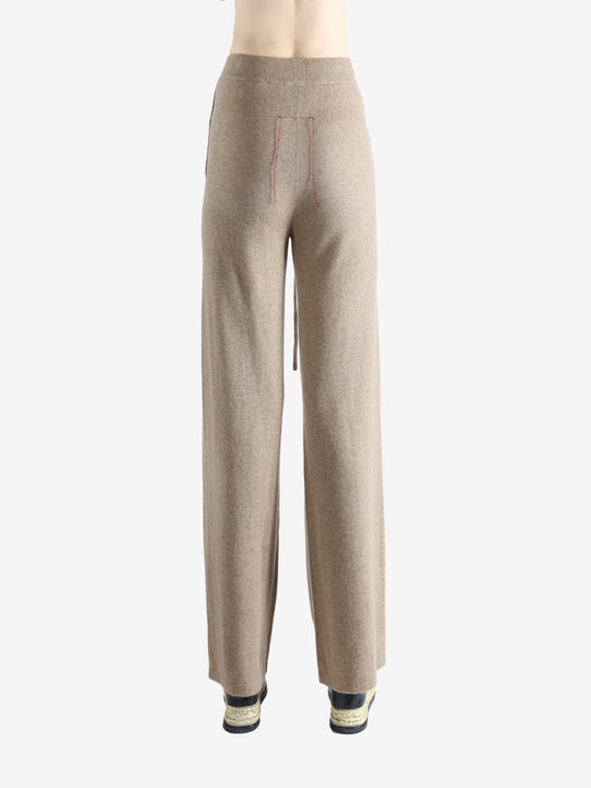 Beige pants worn by a person, showing the pants fit