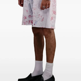 White shorts worn by a person, showing the shorts fit
