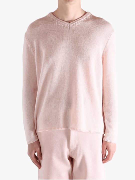 Light pink sweater,worn by a person, showing the sweater fit