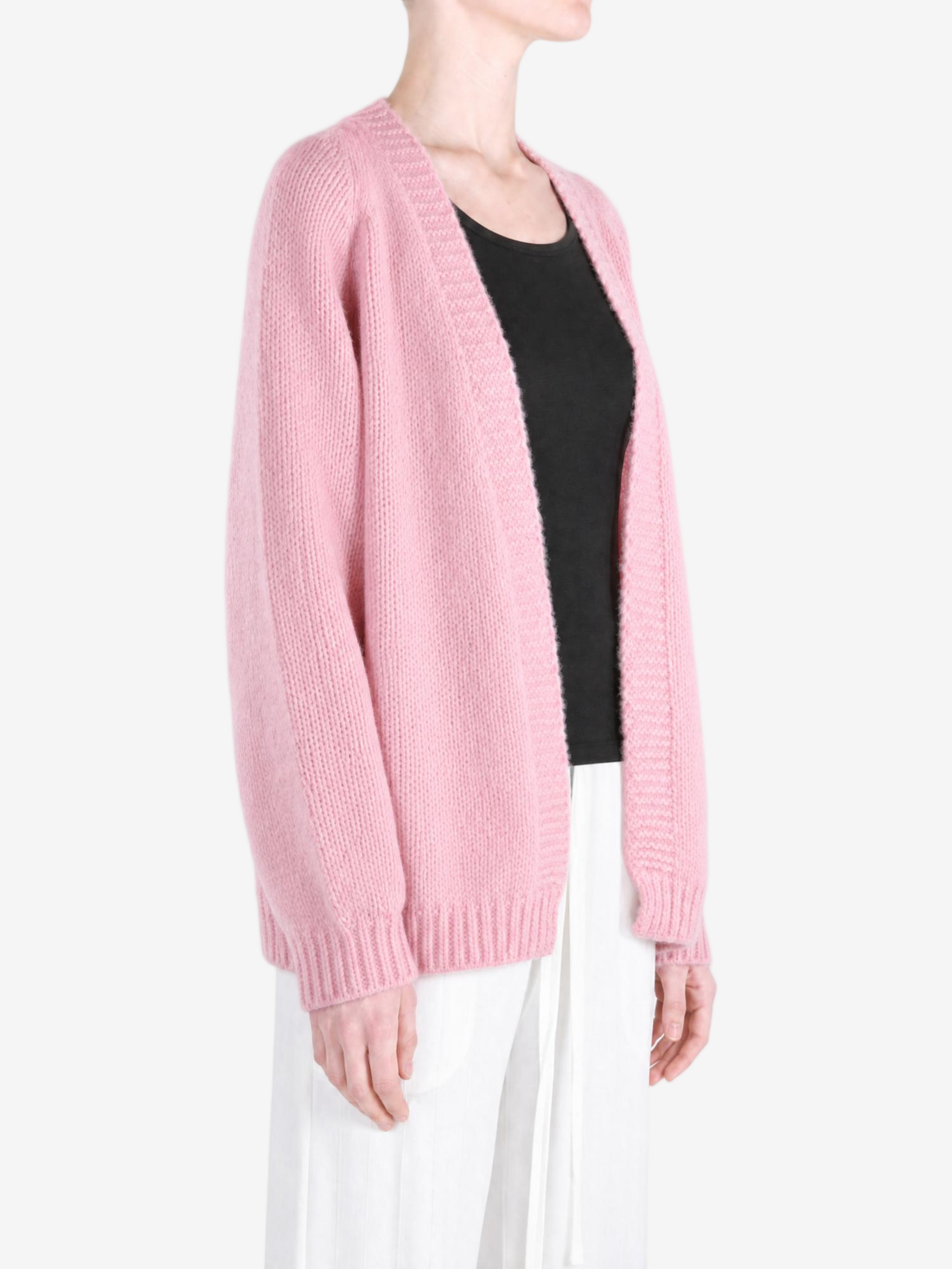 Pink knitwear worn by a person, showing the knitwear fit