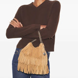 Tan bags worn by a person, showing the bags fit