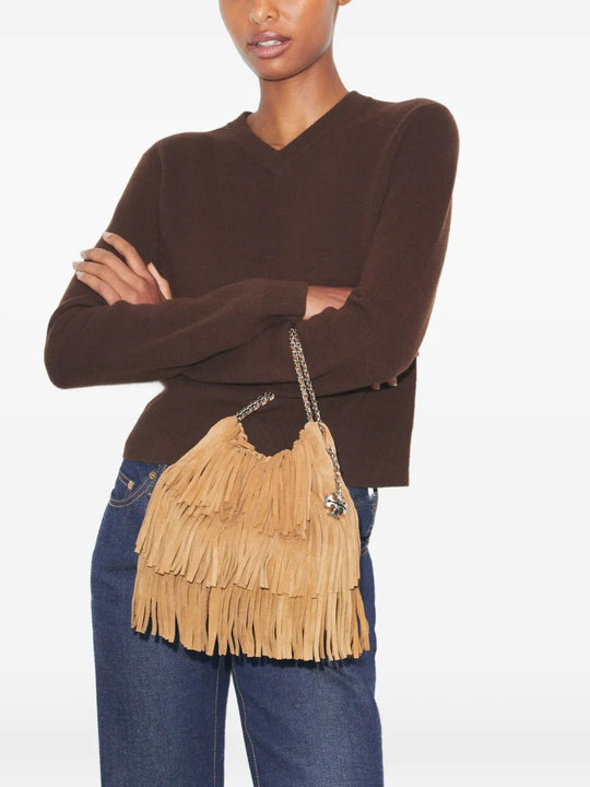 Tan bags worn by a person, showing the bags fit