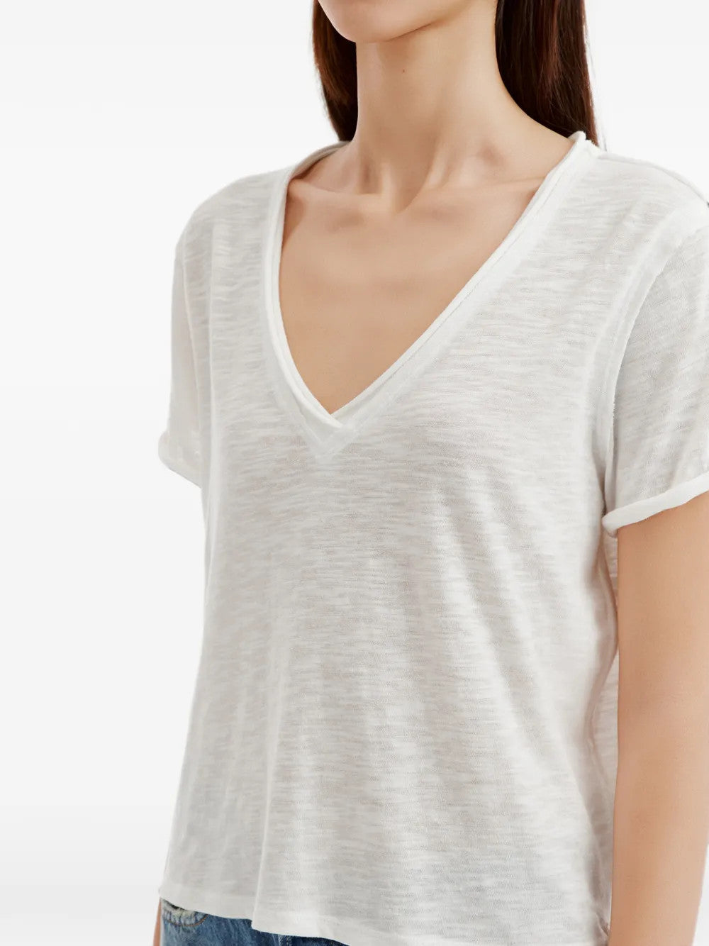 White t-shirt worn by a person, showing the t-shirt fit