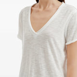 White t-shirt worn by a person, showing the t-shirt fit
