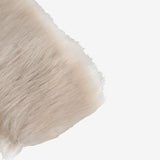 Close up of the white hairband, showing texture of the fur fabric