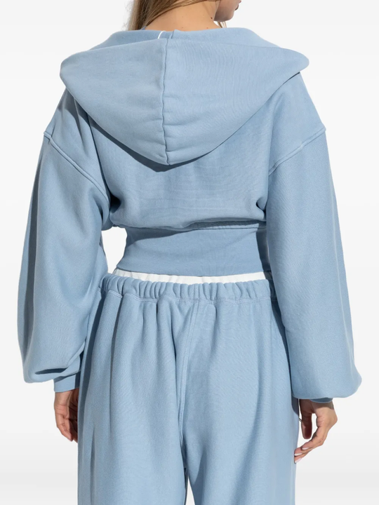 Blue hoodie worn by a person, showing the hoodie fit