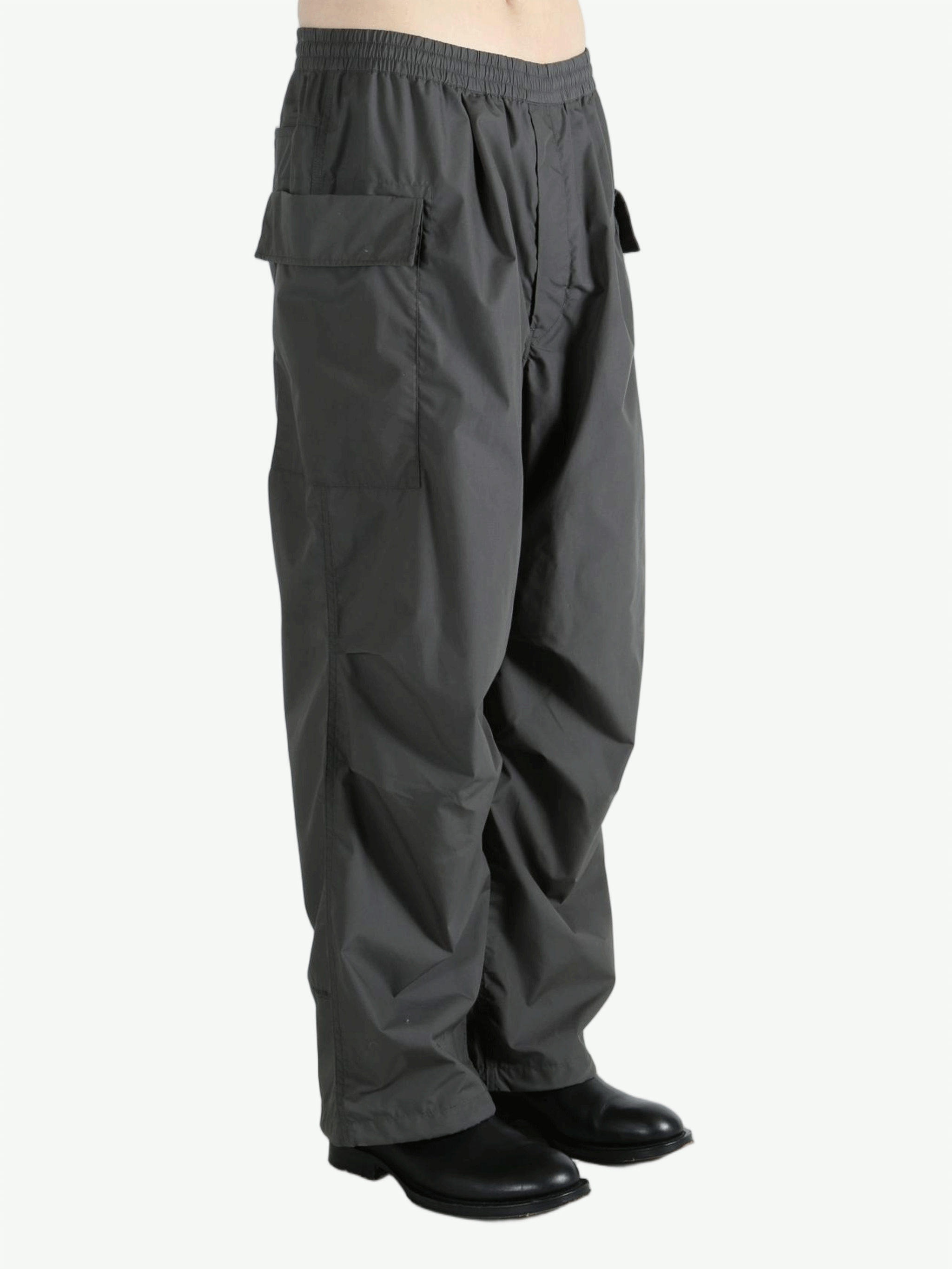 Grey pants worn by a person, showing the pants fit