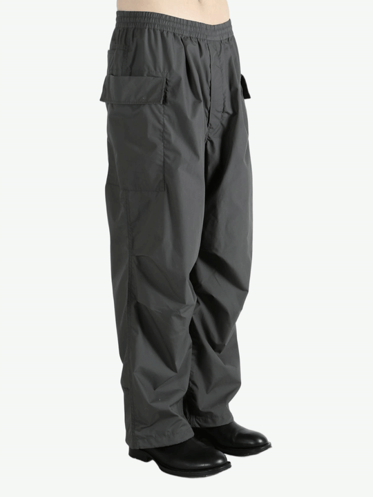 Grey pants worn by a person, showing the pants fit