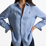 Blue shirt worn by a person, showing the shirt fit