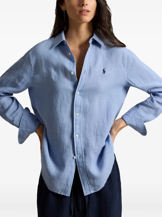 Blue shirt worn by a person, showing the shirt fit