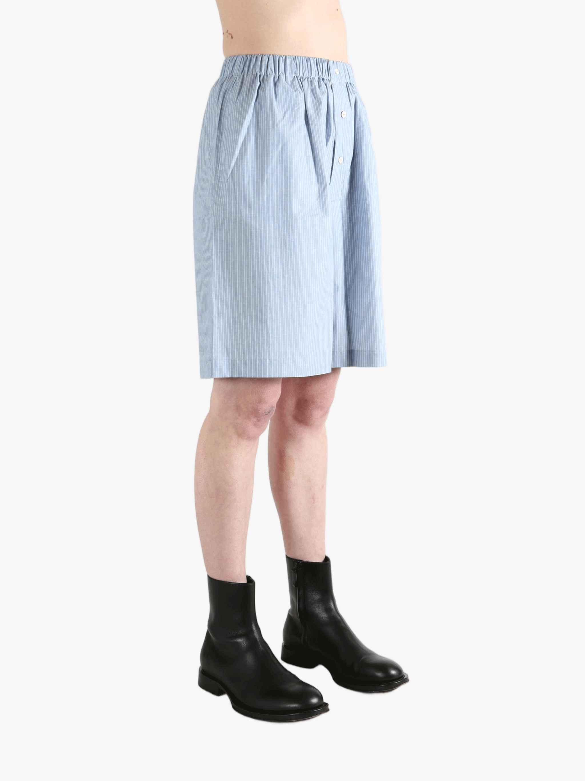 Blue shorts worn by a person, showing the shorts' fit